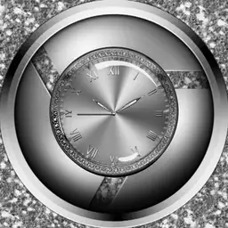 Glitzy silver watch face.