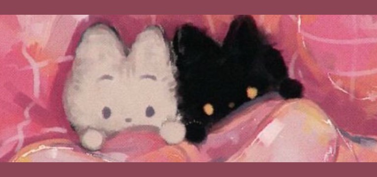 cute kittys in a pink bed