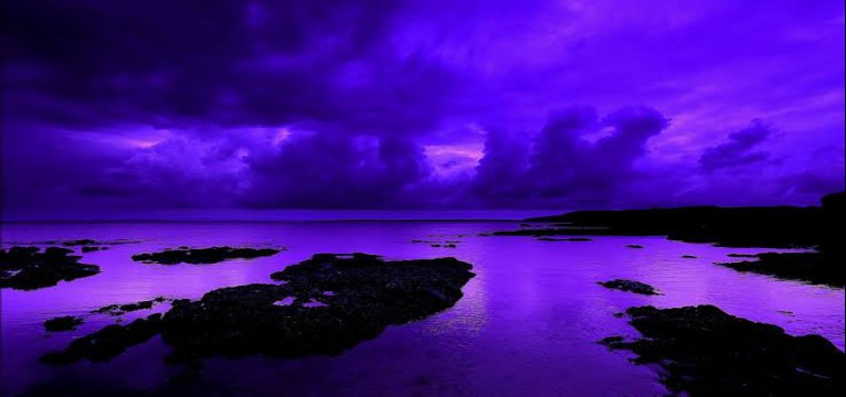 Purple Beach with cloudy sky during sunset